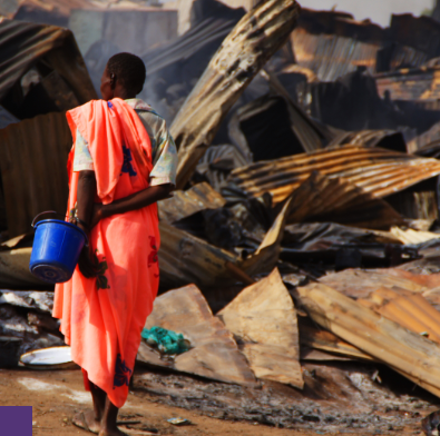 person walking with bucket