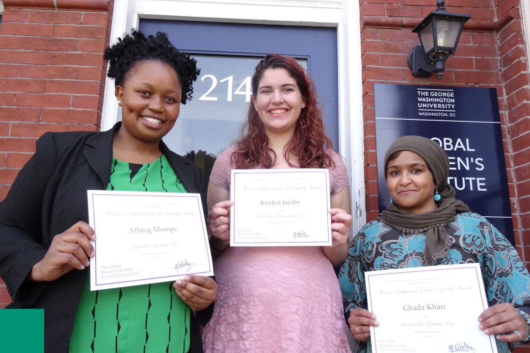 Three women holding certificates
