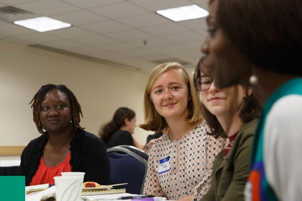 women listening to another woman speak