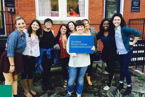 Women holding a GWI sign