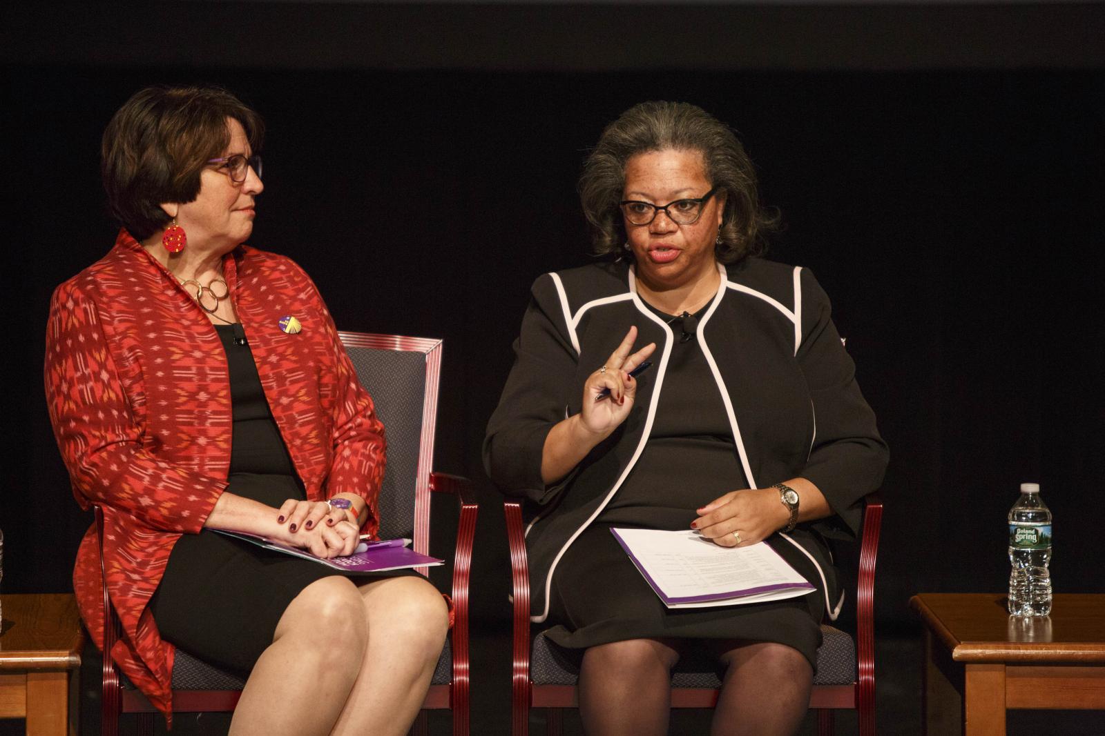 Mary Ellsberg listens to Susan Page speak